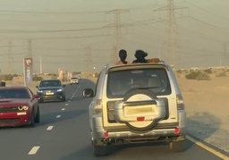 Dubai Police issue warning as motorists seen driving with passengers hanging from car windows; 5 injured falling from moving vehicles featured image